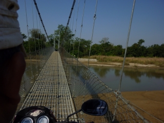 Our motorbike ride included an unexpected narrow cable suspension bridge!