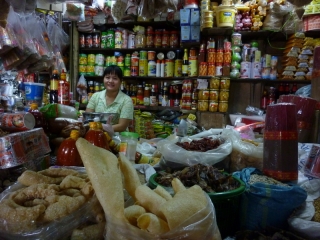 a typical stall at Battambang market, bursting with things to buy and most of them entirely mysterious to me