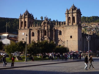 The pleasant Plaza des Armas of Cusco, scattered with tourists and overlooked by the fine colonial cathedral