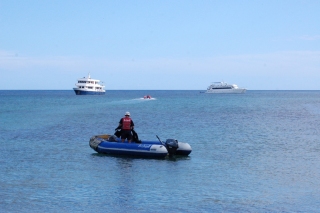 A typical sight off any Galapagos island, a couple of boats anchored and zodiacs bringing visitors ashore
