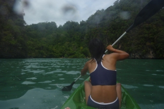 Paddling along on a sea kayak, the only way to travel. If you don't mind being soaked through and worn out