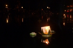 Our krathong floats away across the inky waters