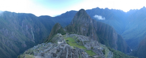 Machu Picchu before the sun has crested the mountains, the deep Urubamba valley on three sides