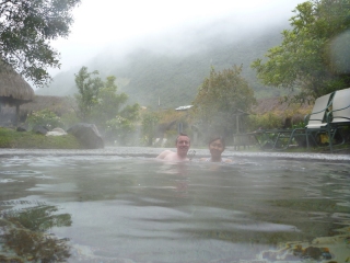Lurking in the hot water while the clouds curl around the cold mountains and drizzle rain on us