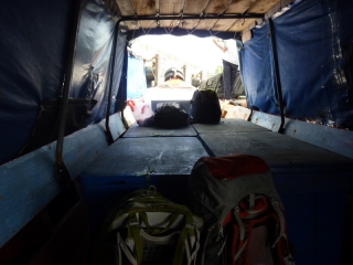 Our trusty backpacks, leaning on the fish crates entombed with us on the wooden ferry to Kuala Perlis
