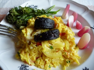 A homely dish of kedgeree with a couple of bits of black pudding perched on top - two items off our must-eat list in one dish