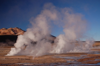 The steaming geysers of El Tatio, finally touched by the sun and soon to melt away