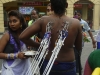 Thaipusan - a truly eye-opening procession of Hindu devotion. Yes, those are climbing carabiners attaching him to the small wagon he\'s towing