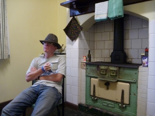 The rugged bush ranger rests by the stove with his hot cocoa. Maureen started laughing when I typed 'rugged'