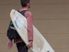 Where else in the world would someone walk out of the central train station with a surfboard?