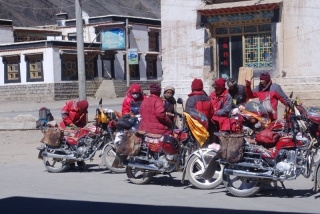 These bikers are traders who buy and sell between villages