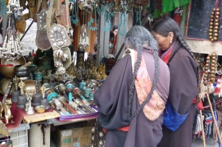 Long-haired pilgrims stop to shop in the Barkhor market
